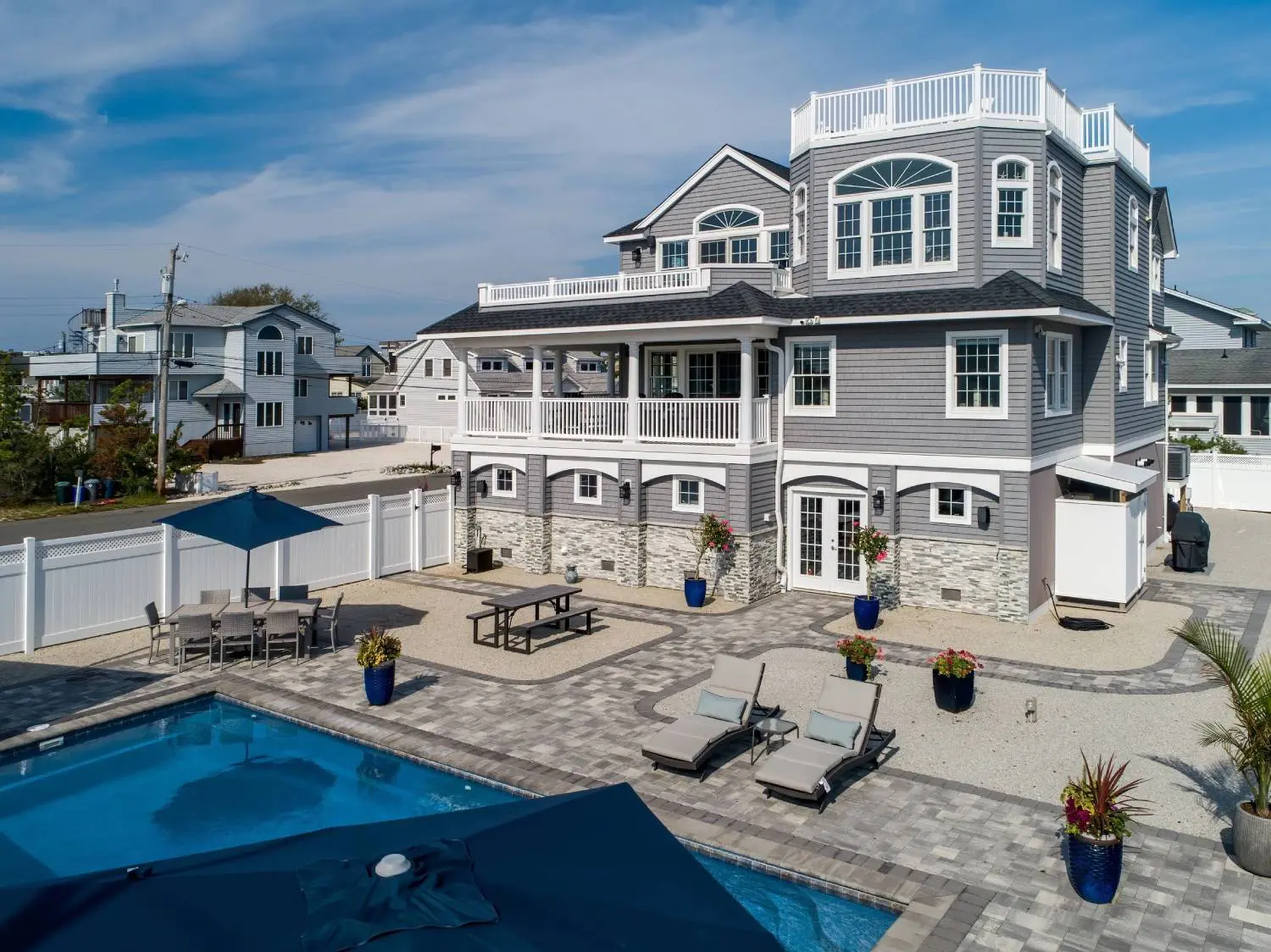 A large house with a pool in the middle of it