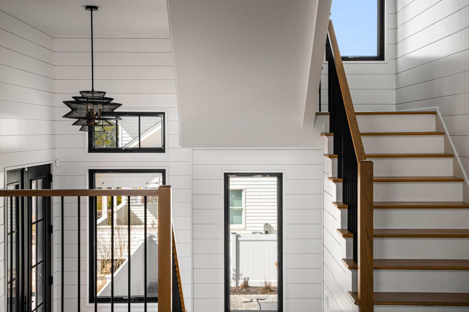 A view of the stairs from inside a house.