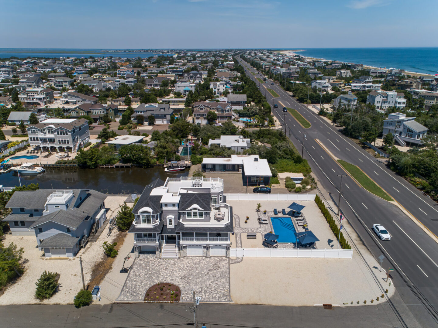 A view of the ocean and houses from above.