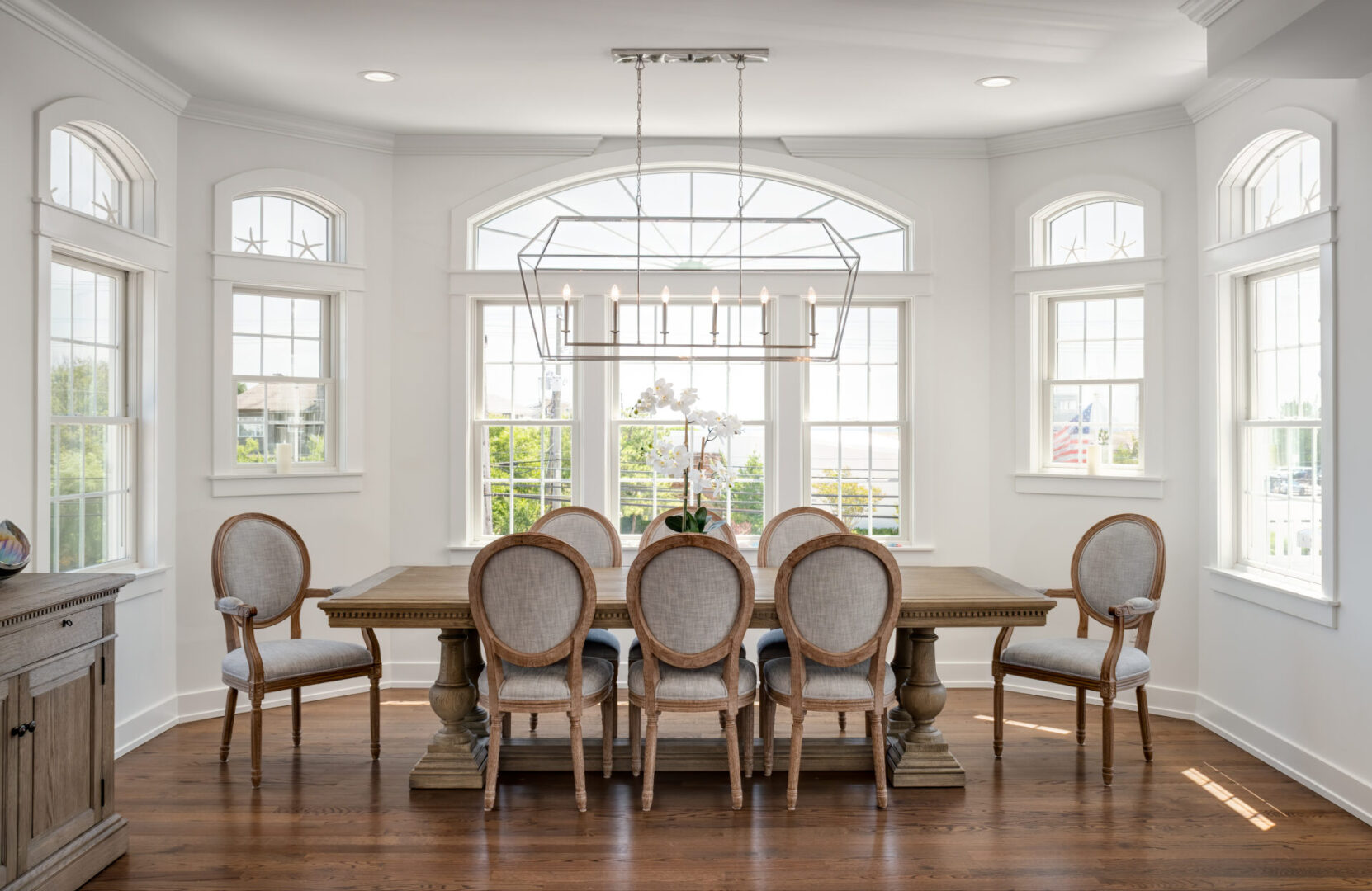 A dining room table with chairs around it