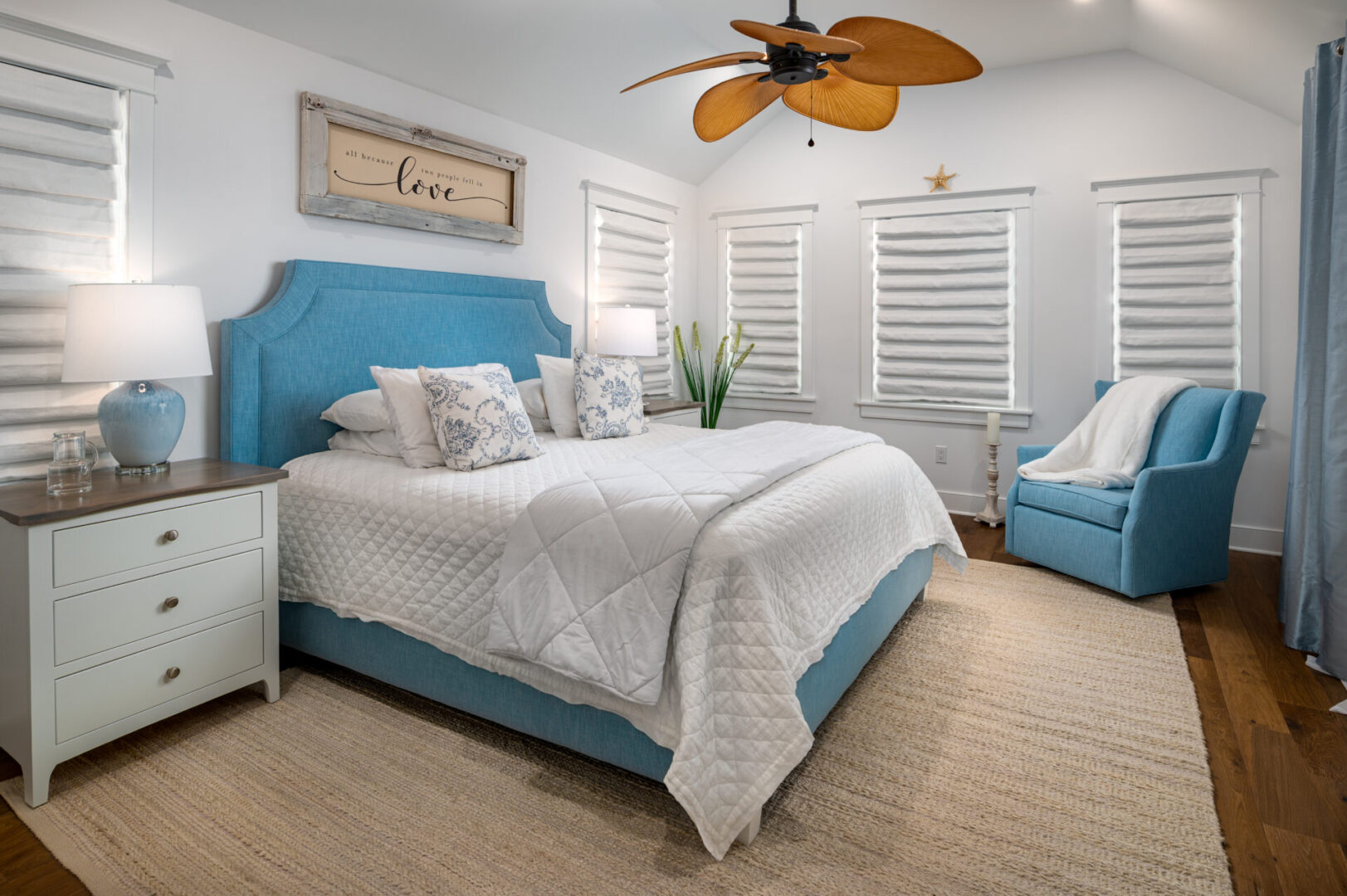 A bedroom with a bed, dresser and window.