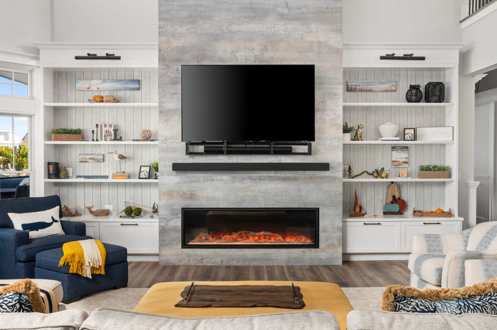 A living room with a fireplace and a flat screen tv.