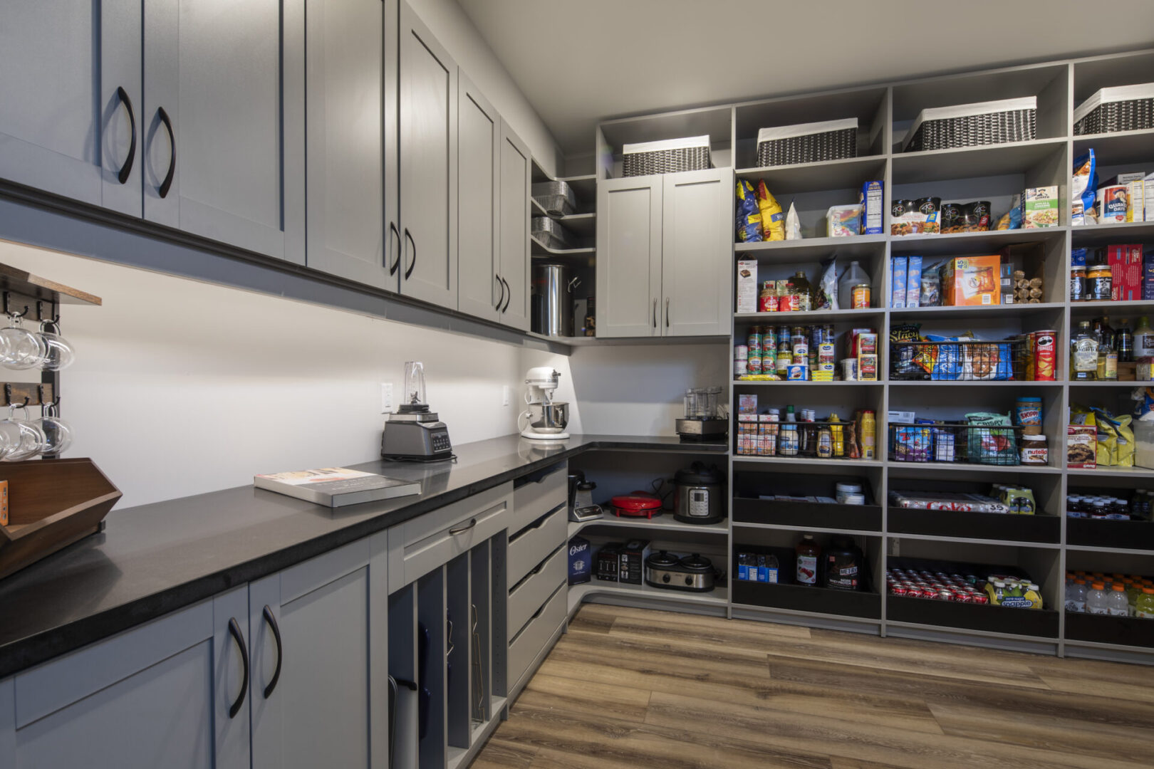 A kitchen with shelves and cabinets in it